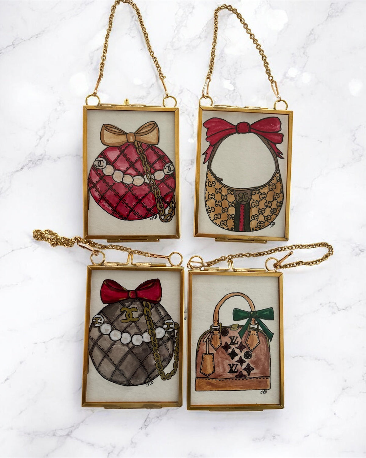Four framed illustrations of handbags with decorative bows on a marble surface